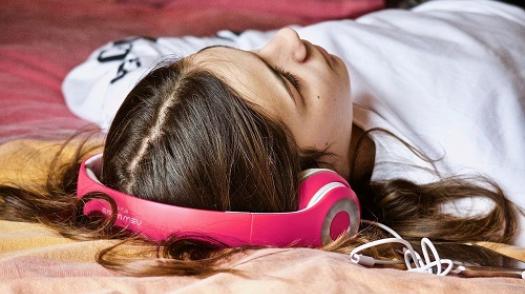 Teenager listening to music