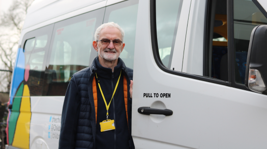 Tim, a volunteer driver, opening van door