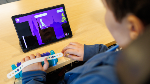A child using assistive technology.