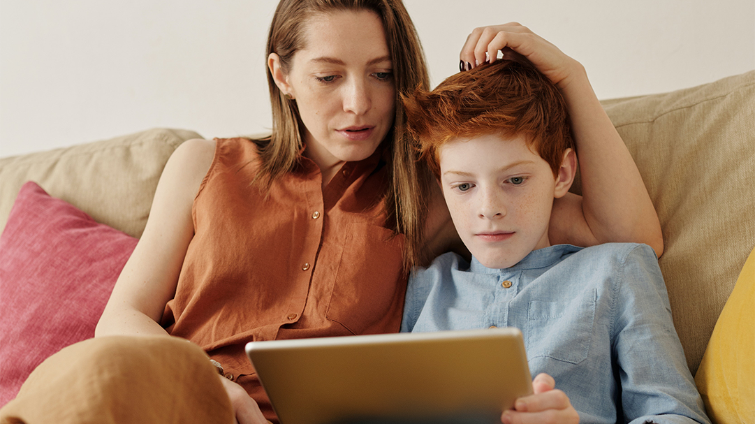 parent and child on sofa