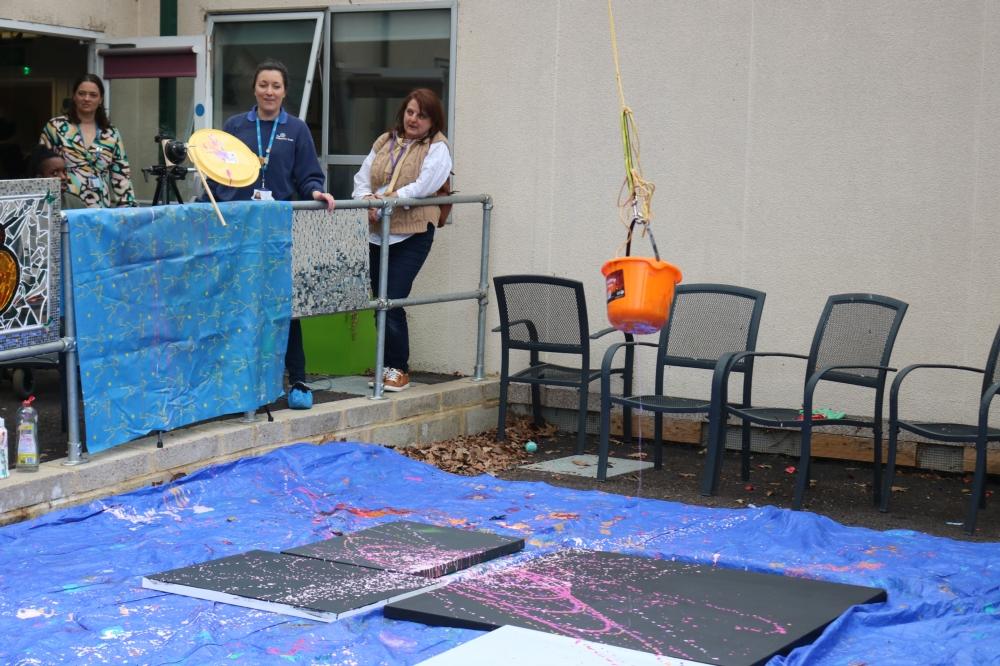 Bucket swinging over a canvas