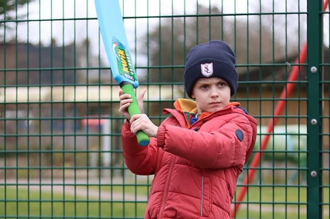 Hubert playing cricket