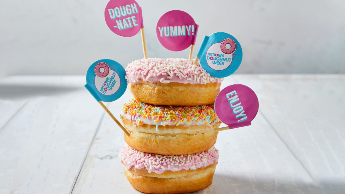 A stack of three decorated doughnuts
