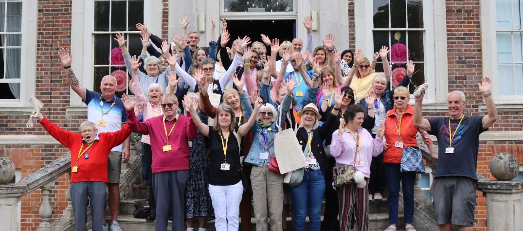 Some of our volunteers standing outside of the mansion at Tadworth Court