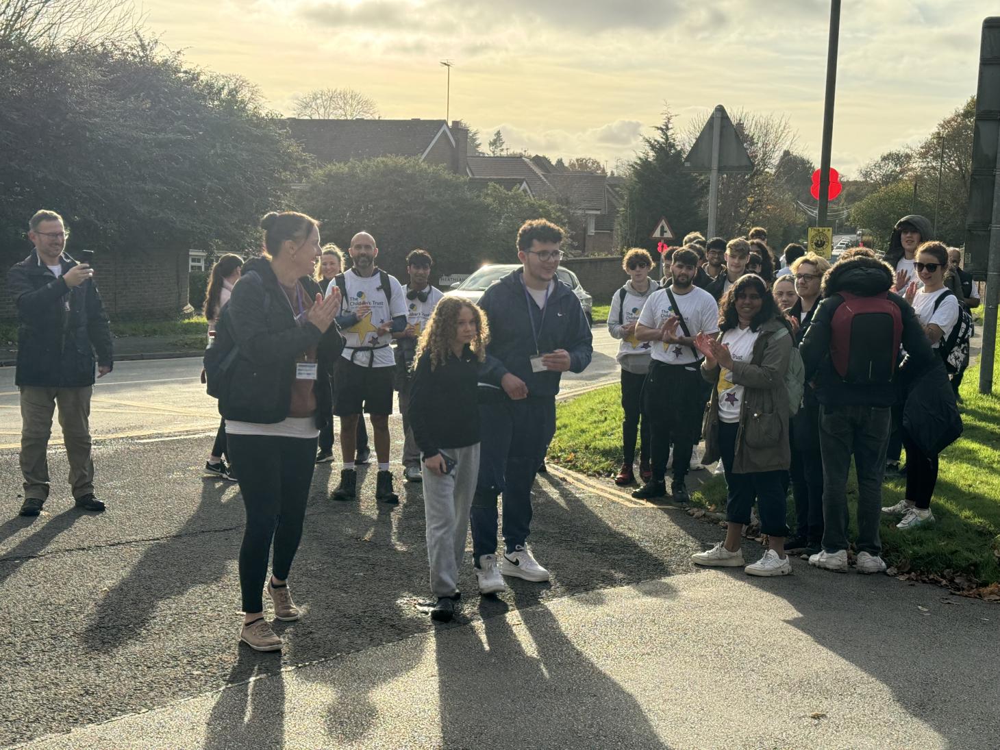 Rio walking into The Children's Trust with his classmates