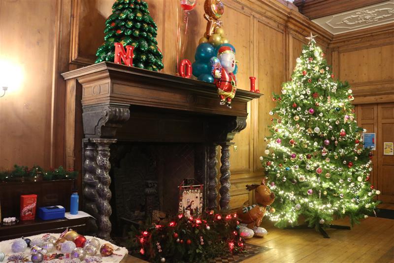 The main hall within The Children's Trust decorated with Christmas decorations.