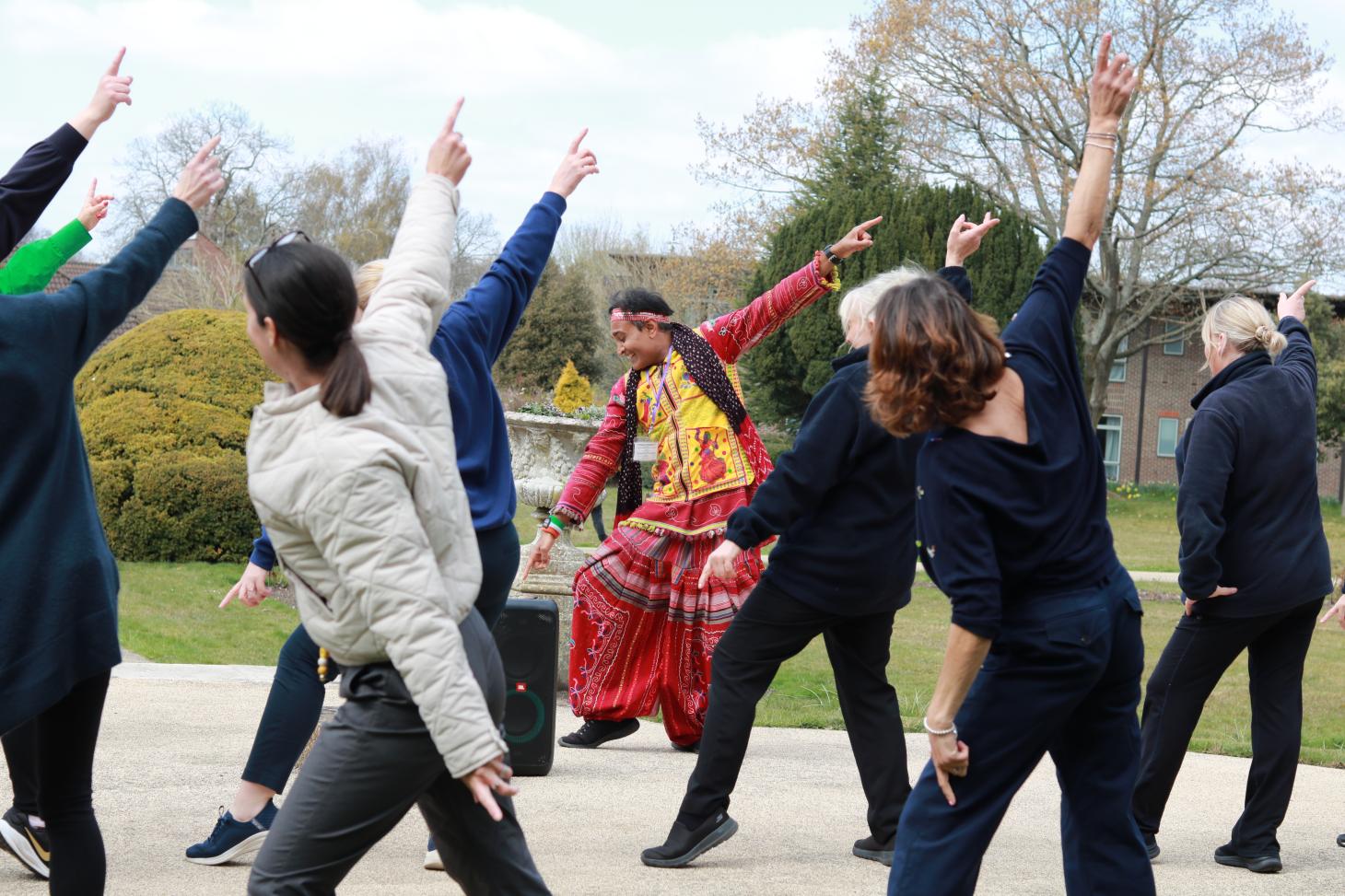 group of people Bollywood dancing