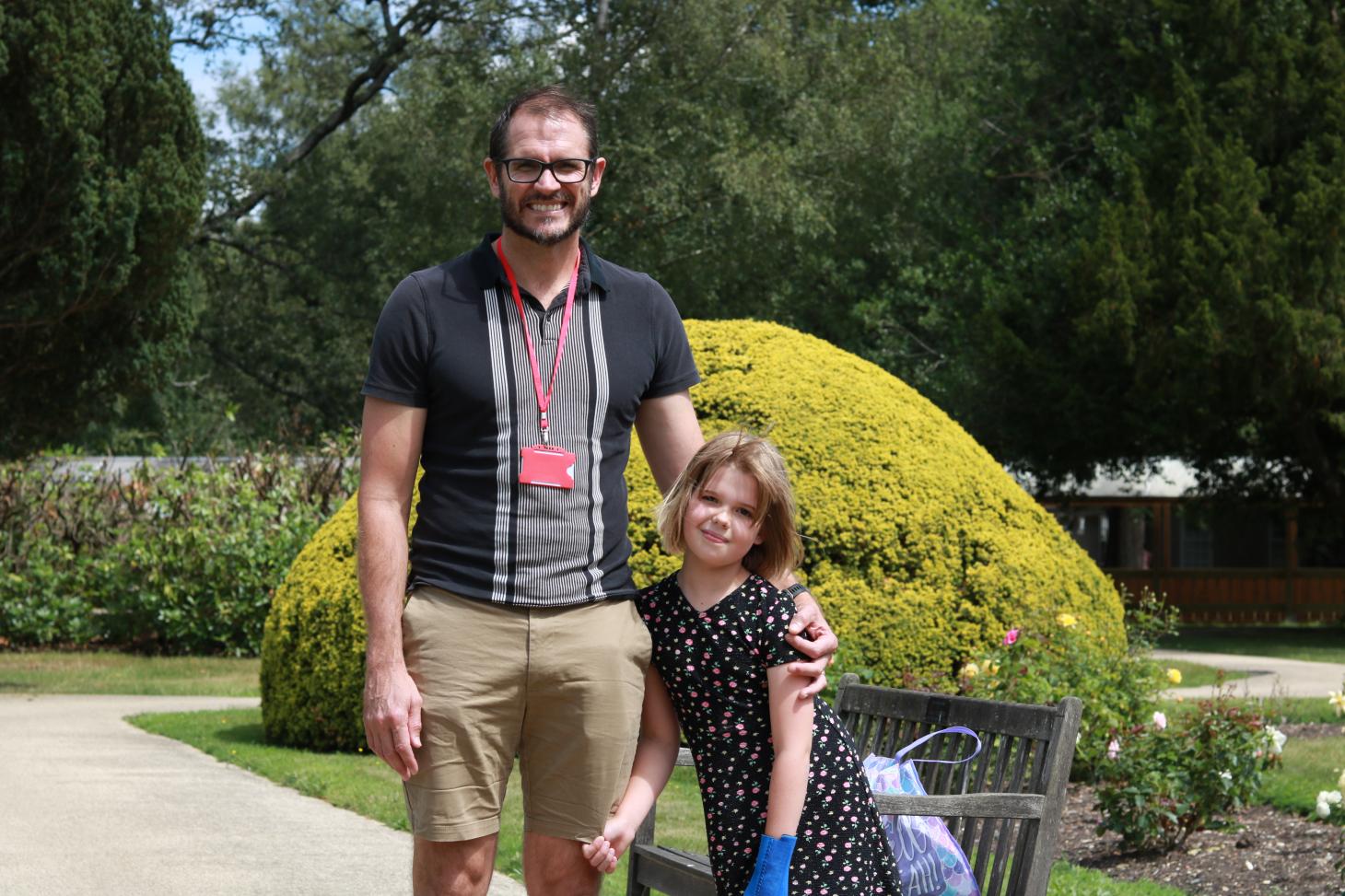 Marnie and her dad Gareth smile at the camera