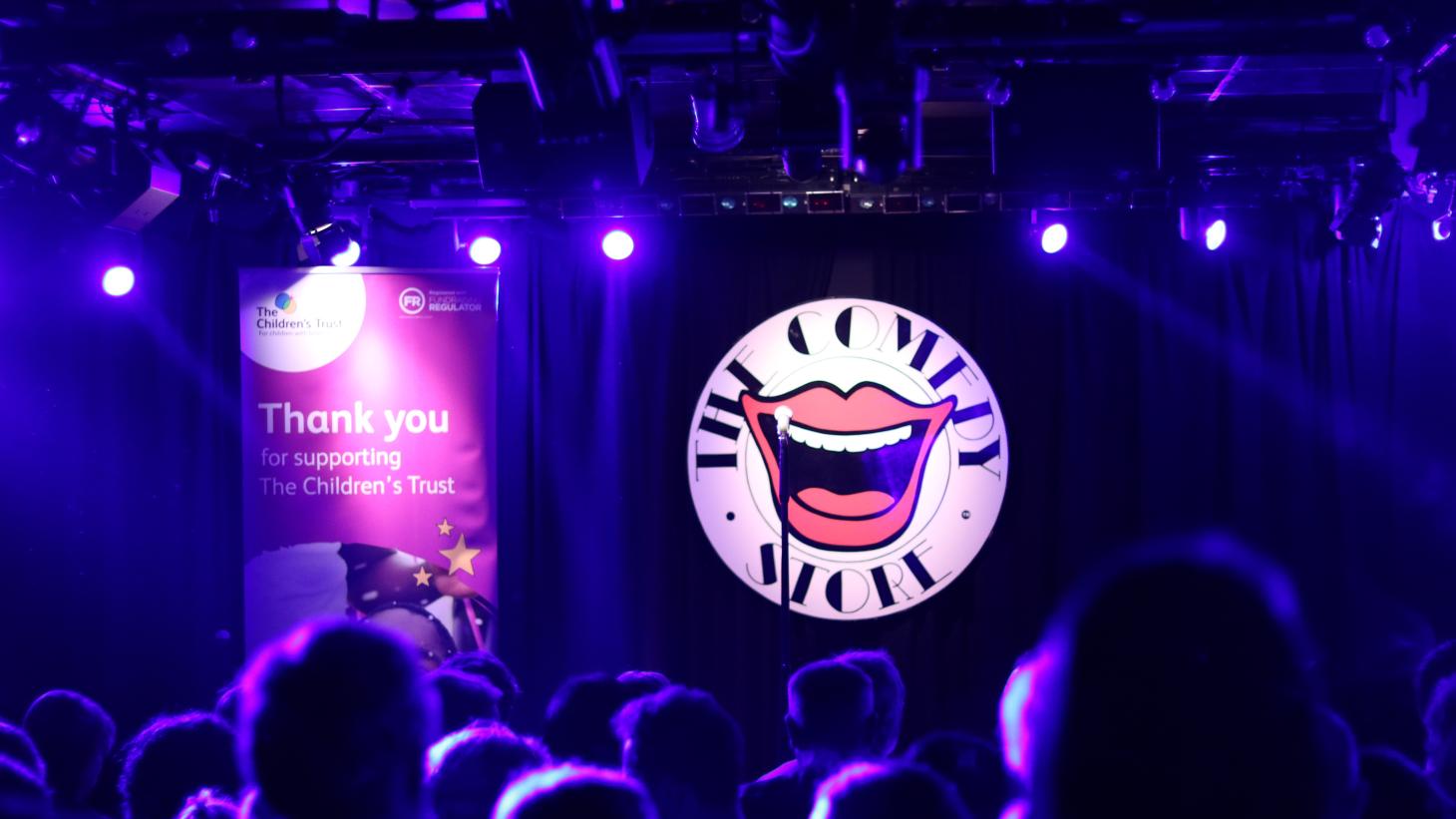Crowd of people watching the children's trust comedy night 