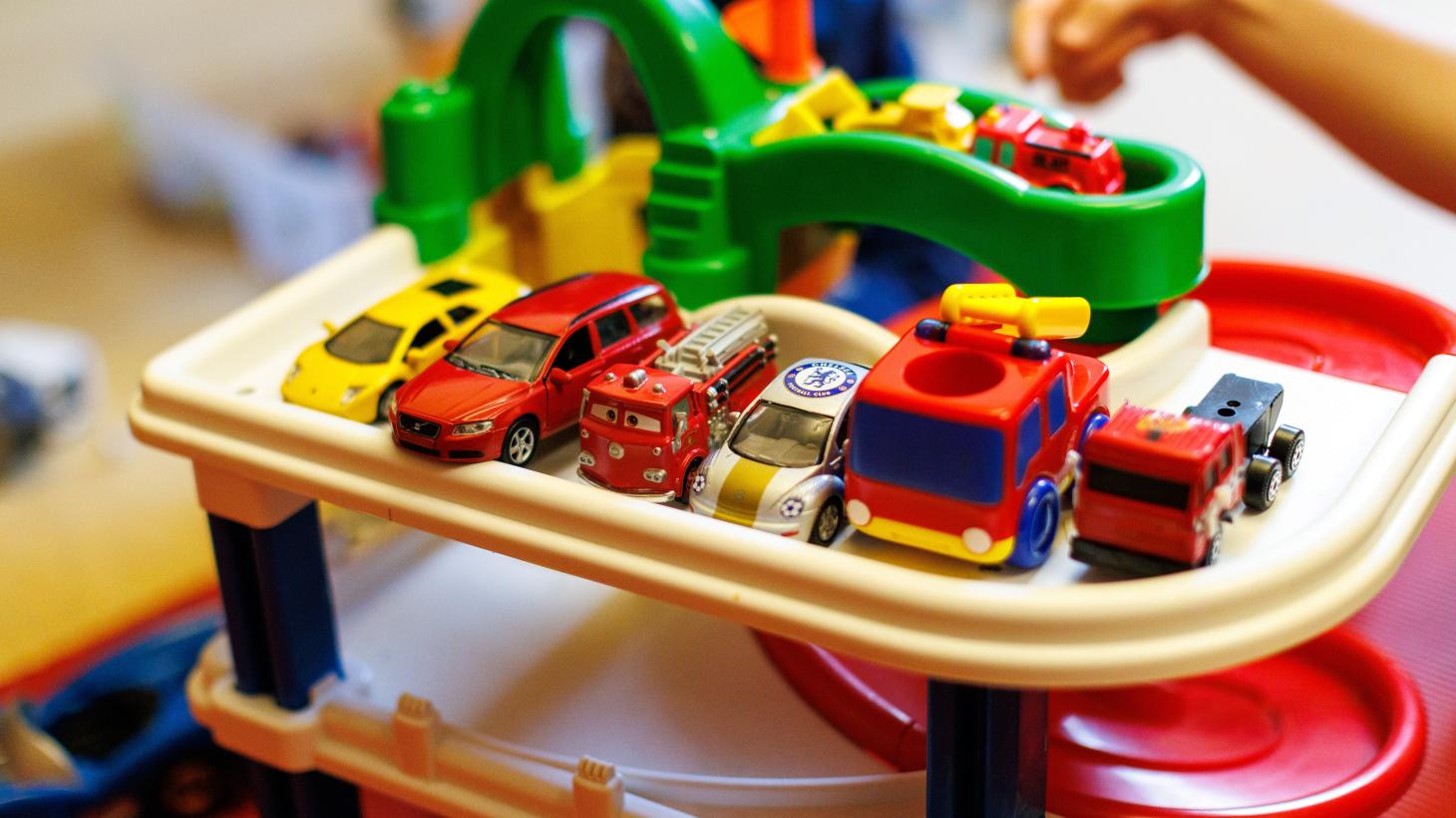 Child playing with toy cars 