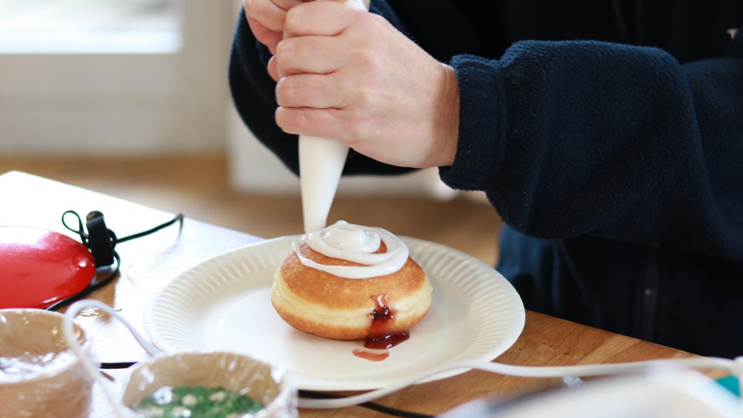 lady decorating doughnuts 