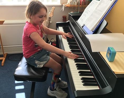 Jasmine playing piano