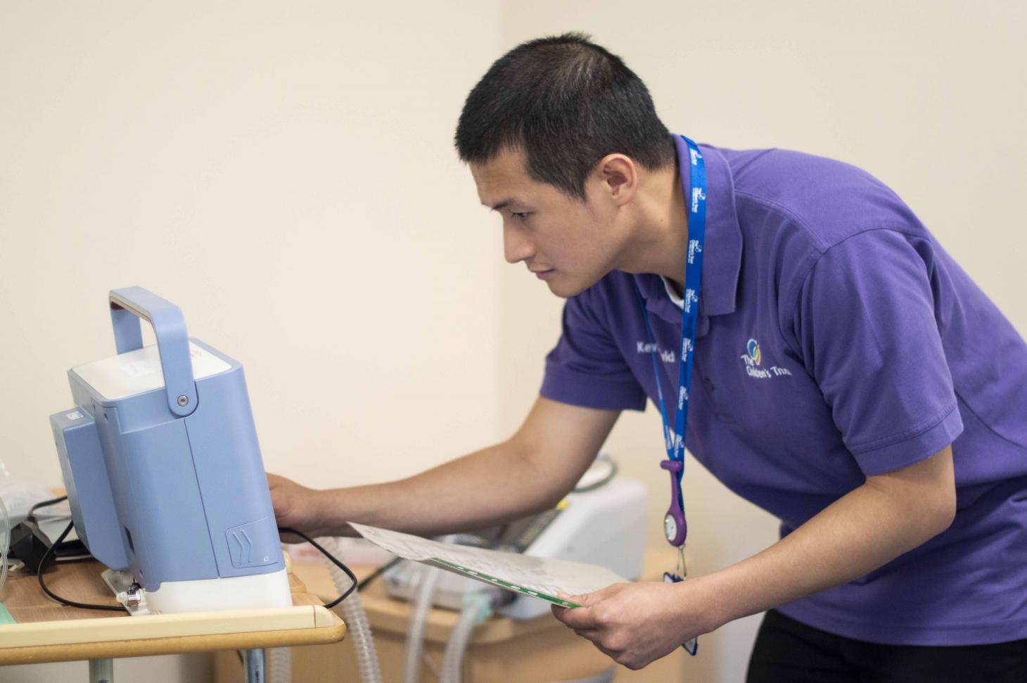 Nurse using ventilator