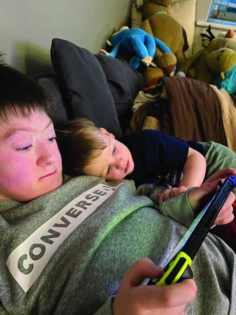 Ellis at home playing his game console