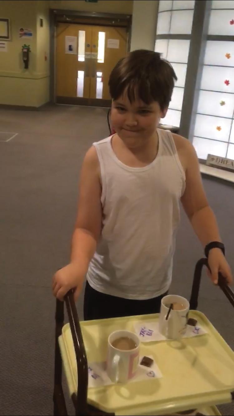 Joey making tea at The Children's Trust