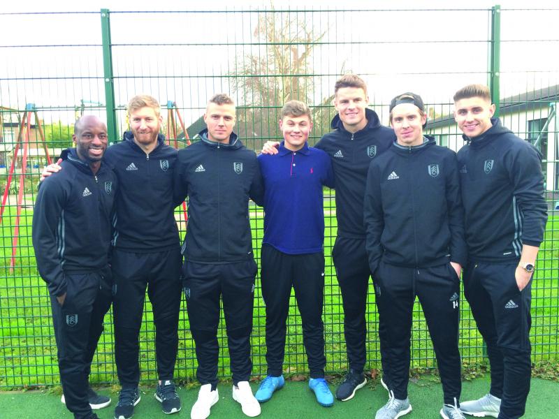 Liam with Fulham football players