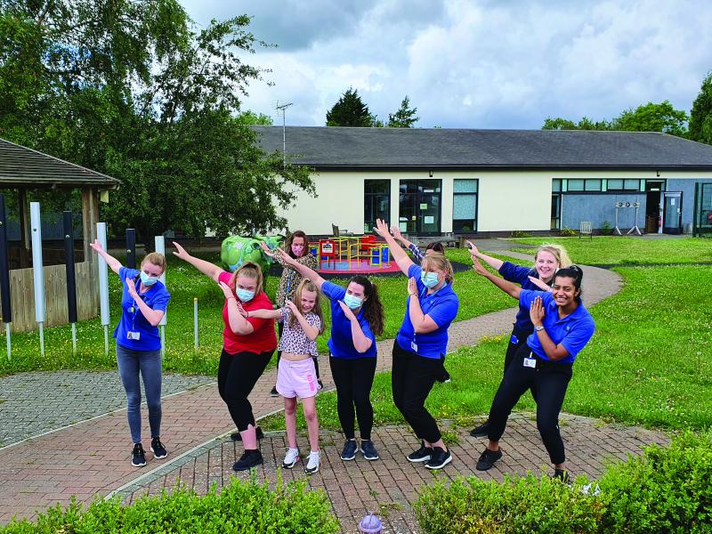 Lily with her rehab team at The Children's Trust