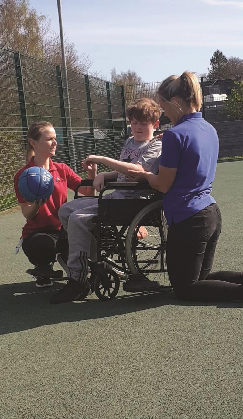 Marli at The Children's Trust in his wheelchair
