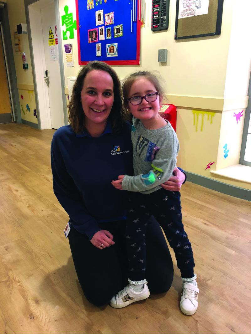 Mollie with staff at The Children's Trust