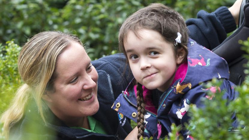 Disabled girl in a garden