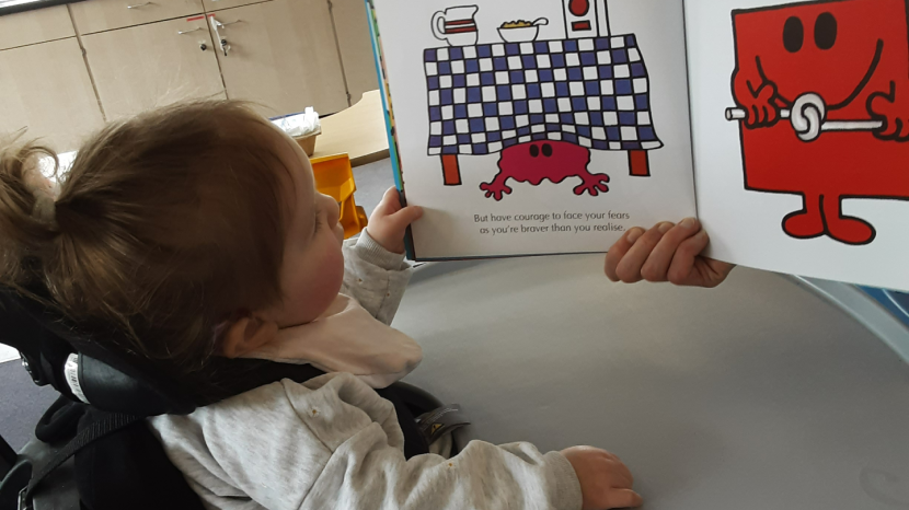 Molly reading a Mr Men Book