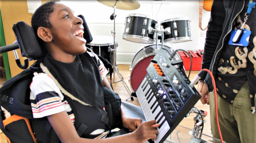 Josiah playing on a keyboard