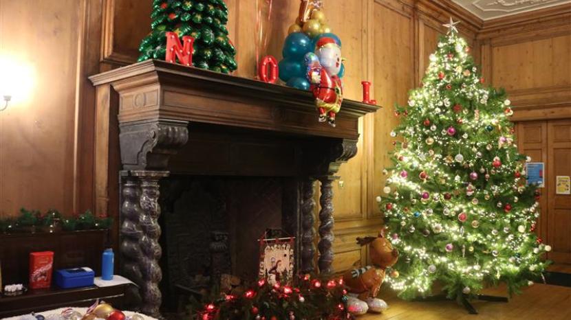 The main hall within The Children's Trust decorated with Christmas decorations.