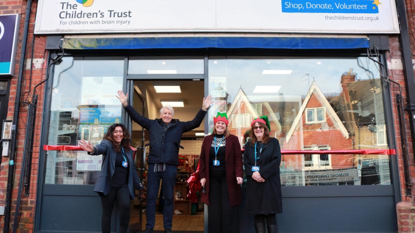 Nicholas Owen and staff in front of the shop